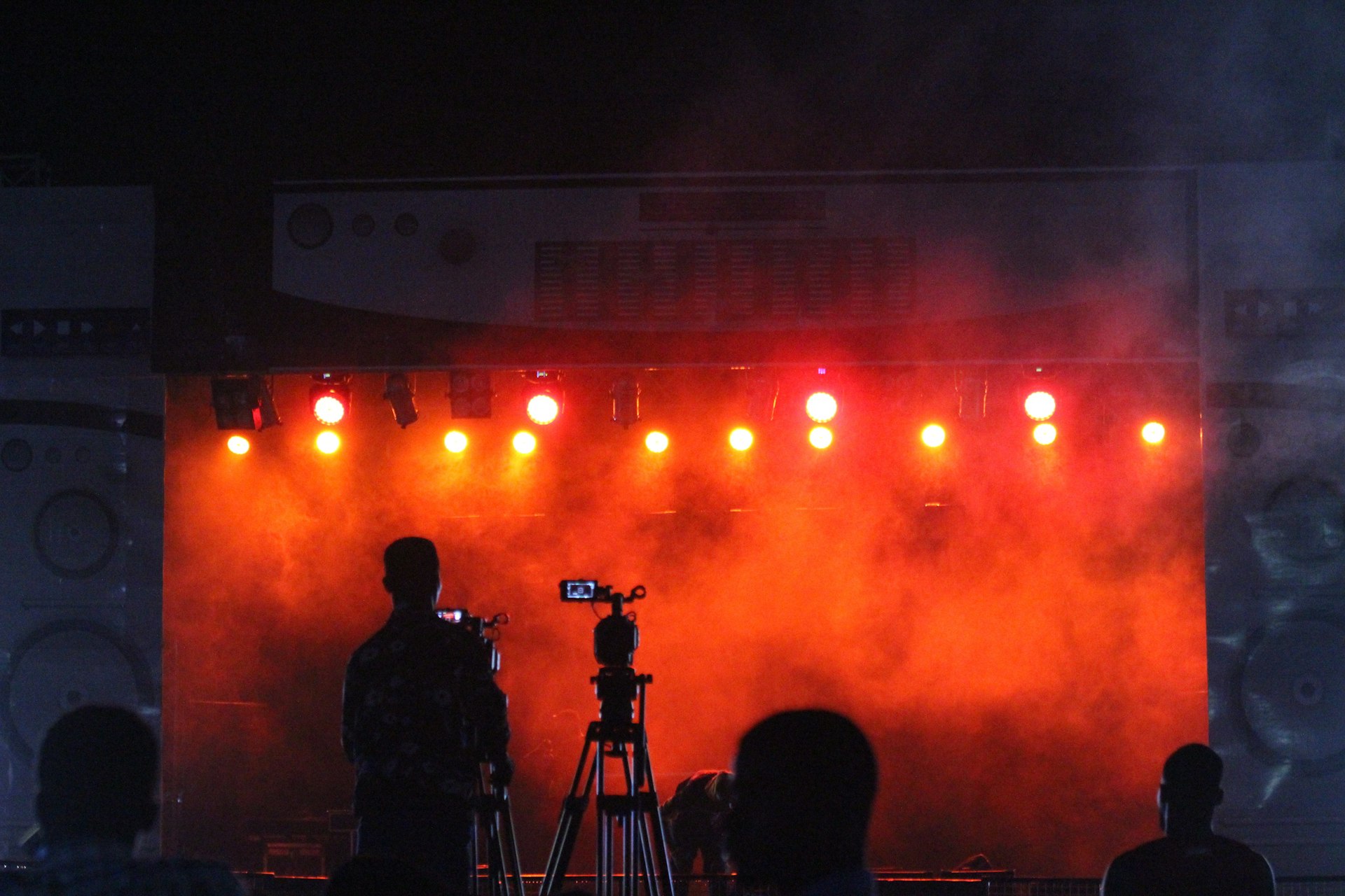 silhouette of people standing on stage
